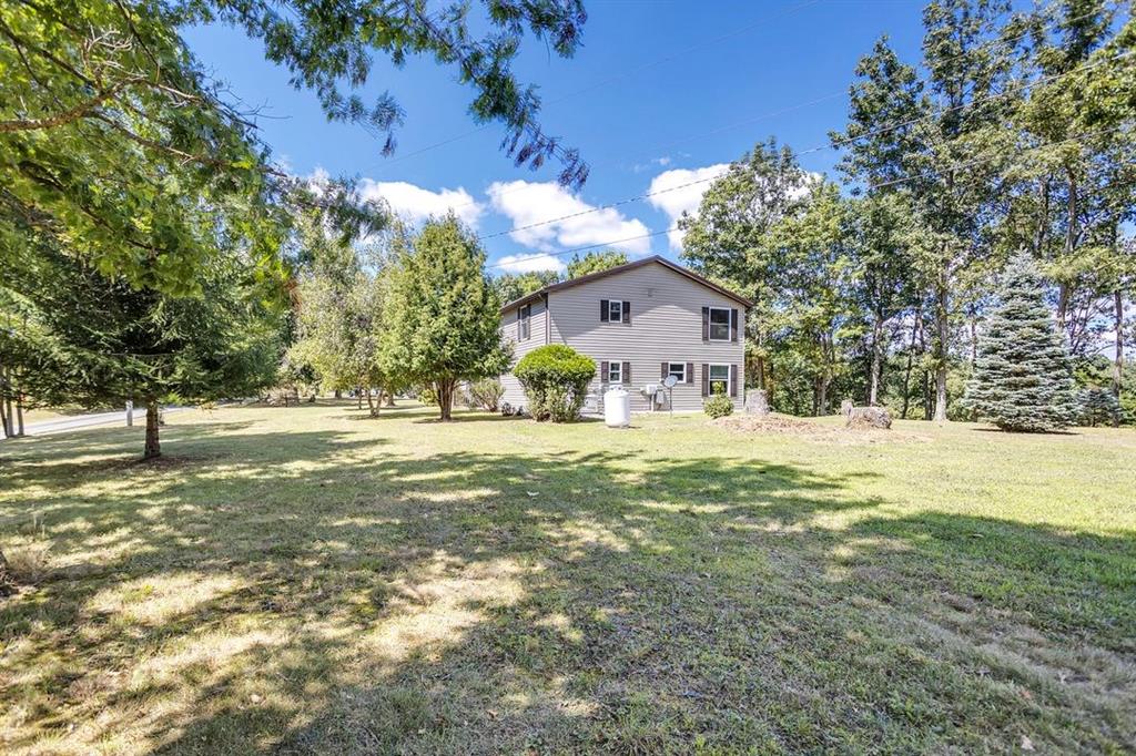 1130 Ridge Road Templeton, PA 16259 - Photo 21 of 25 a view of a house with a yard and tree s