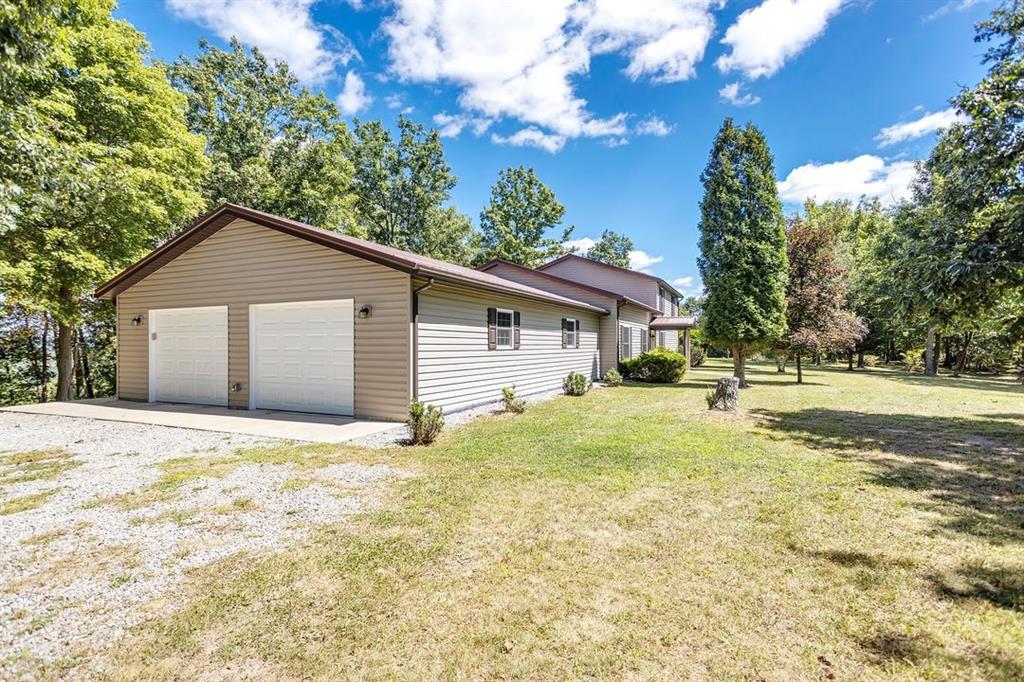 1130 Ridge Road Templeton, PA 16259 - Photo 23 of 25 a view of a house with a yard and large tree