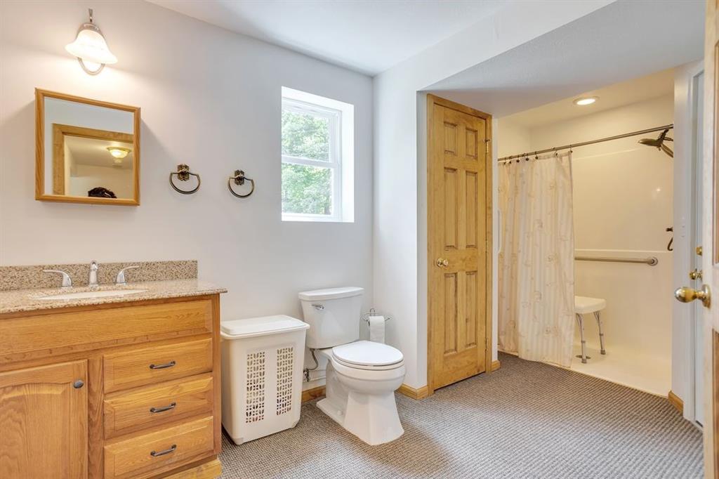 1130 Ridge Road Templeton, PA 16259 - Photo 10 of 25 a bathroom with a toilet a sink and a mirror