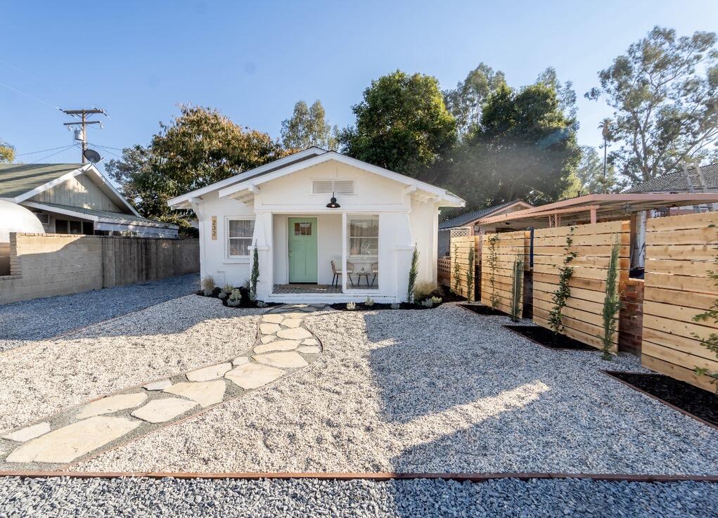 232 Ash Street Exeter, CA 93221 - Photo 1 of 13 a view of a house with a yard covered in snow