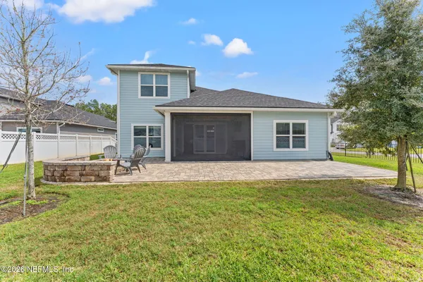 a front view of house with yard and outdoor seating