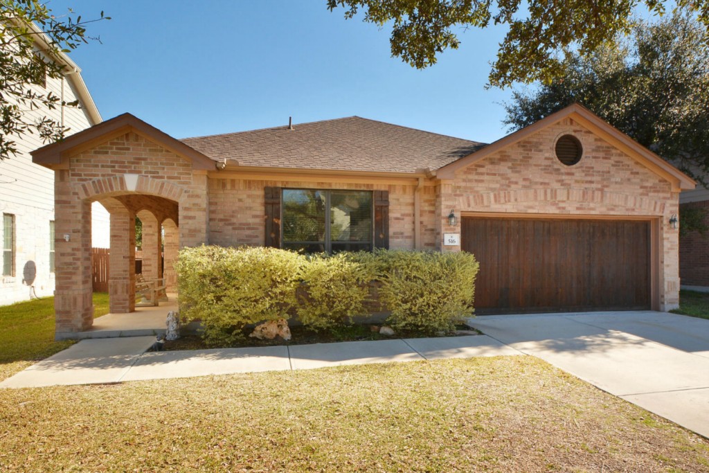 516 Tyree Road Cedar Park, TX 78613 - Photo 1 of 1 a front view of a house with a yard and garage