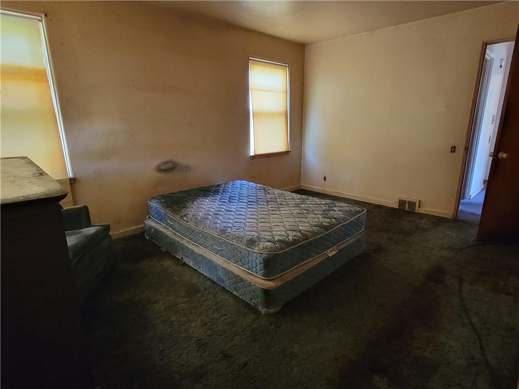 421 Hays Road Venetia, PA 15367 - Photo 9 of 28 a bed sitting in a bedroom next to a window