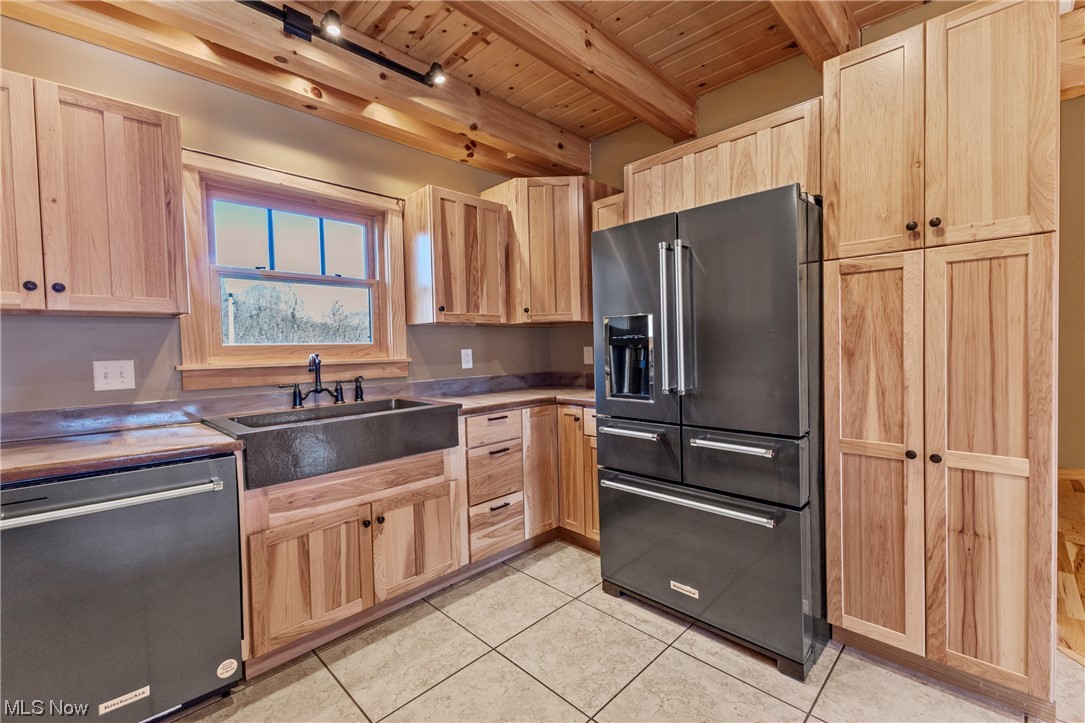 485 Dry Ridge Road Cameron, WV 26033 - Photo 7 of 35 Kitchen featuring wooden ceiling, stainless steel dishwasher, light tile flooring, beam ceiling, and high end black refrigerator