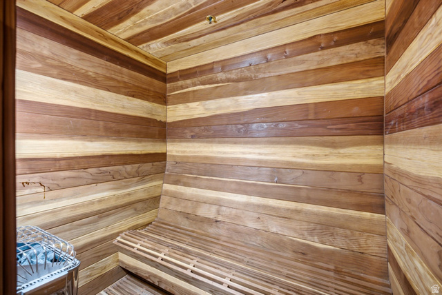 5971 Maple Ridge Trail Oakley, UT 84055 - Photo 35 of 43 Wood-paneled sauna featuring a built-in slatted bench, stainless steel heater, and ceiling-mounted sprinkler head