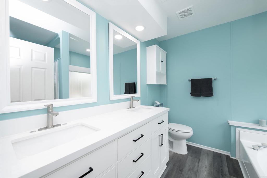 909 Richland Road, Unit 79 San Marcos, CA 92069 - Photo 12 of 17 a bathroom with a sink and a mirror