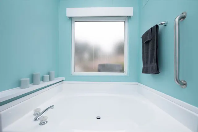 a bathroom with a tub and a sink
