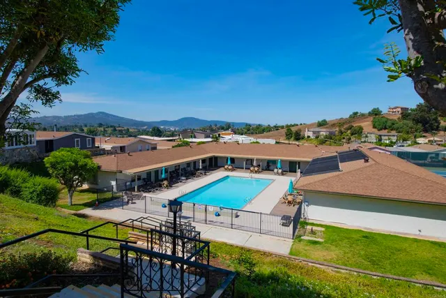 an aerial view of a city with lawn chairs