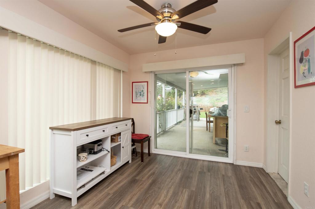 909 Richland Road, Unit 79 San Marcos, CA 92069 - Photo 8 of 17 a view of an empty room with window and wooden floor