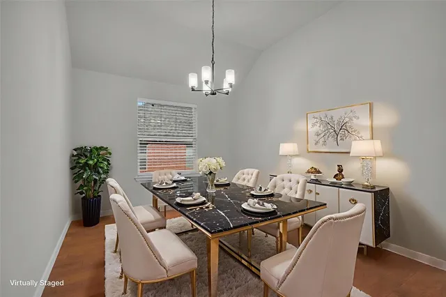 a view of a dining room furniture and chandelier
