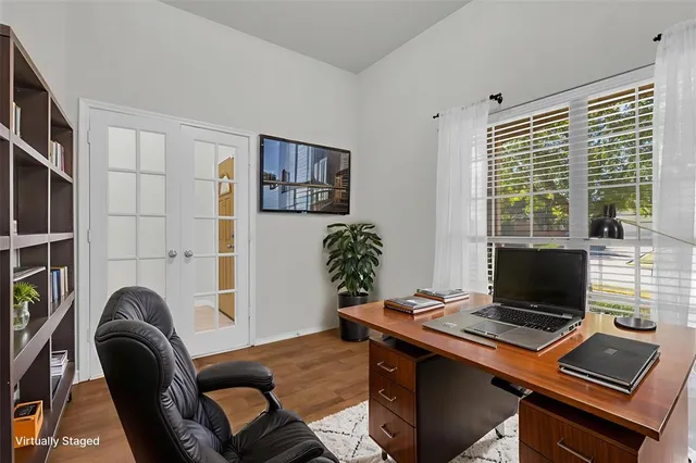a laptop computer sitting on top of a desk