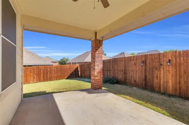 a view of a patio with swimming pool