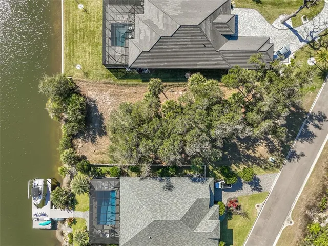 an aerial view of a house with a yard and garden