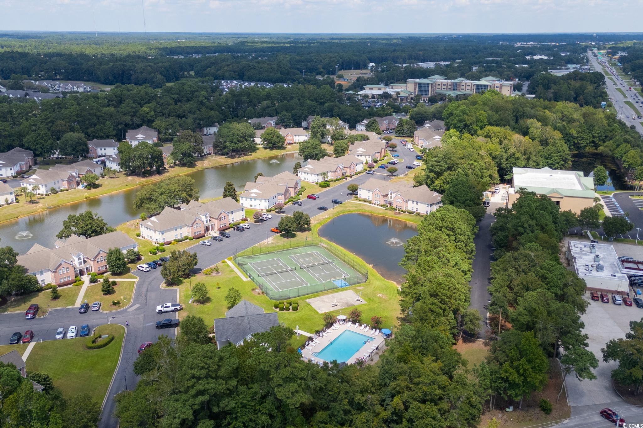 4283 Santolina Way, Unit D Murrells Inlet, SC 29576 - Photo 27 of 31 Drone / aerial view of a nearby body of water and a pool area