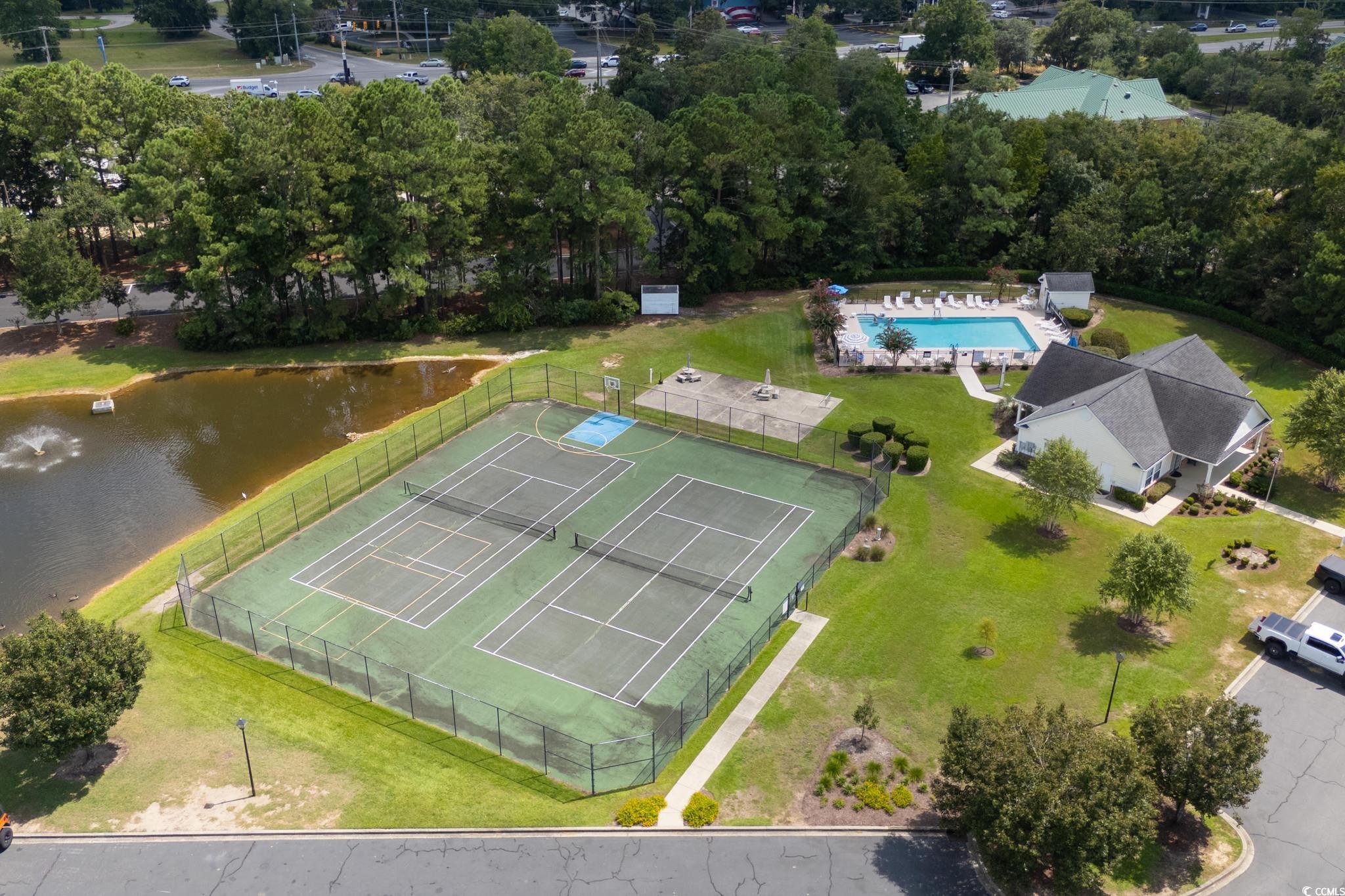 4283 Santolina Way, Unit D Murrells Inlet, SC 29576 - Photo 28 of 31 Drone / aerial view of a nearby body of water and a pool
