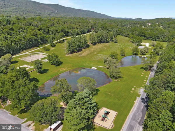 a view of a playground with basketball court