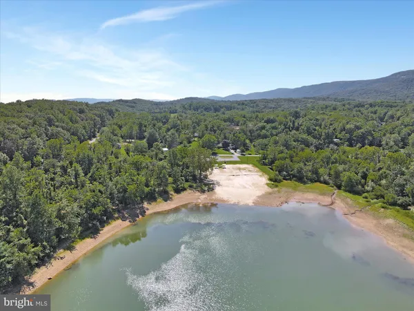 a view of a lake with mountains in the background