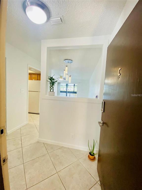 633 North Keene Road, Unit C Clearwater, FL 33755 - Photo 2 of 20 a bathroom with a sink and a mirror