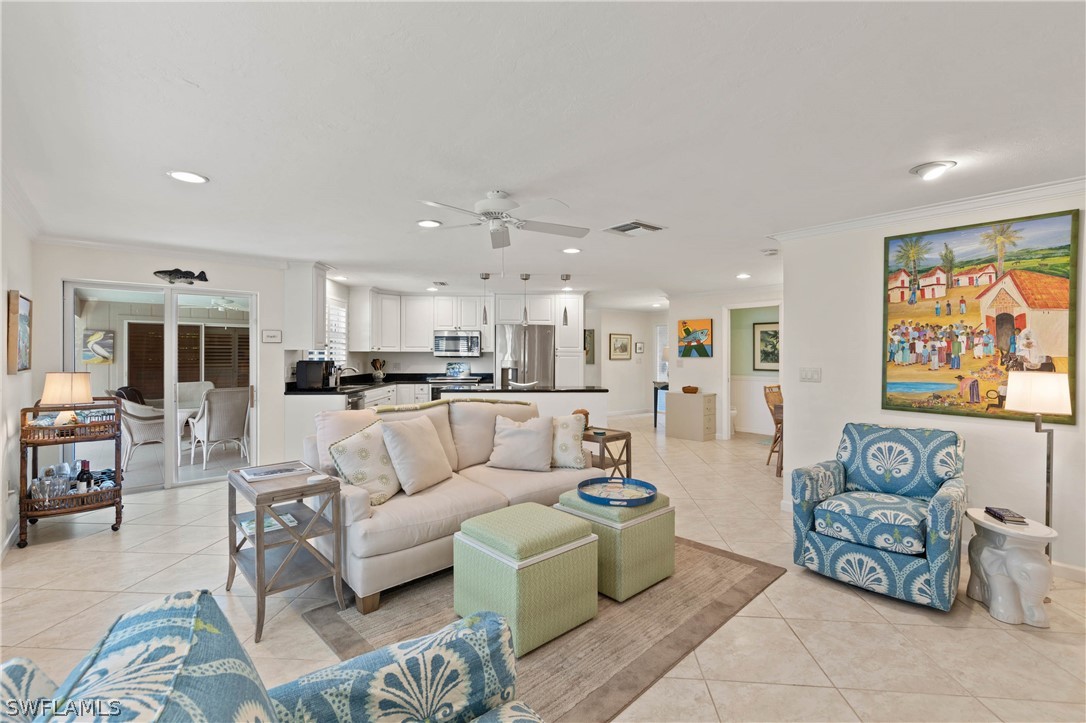 975 Sand Castle Road Sanibel, FL 33957 - Photo 14 of 24 a living room with furniture and a view of kitchen