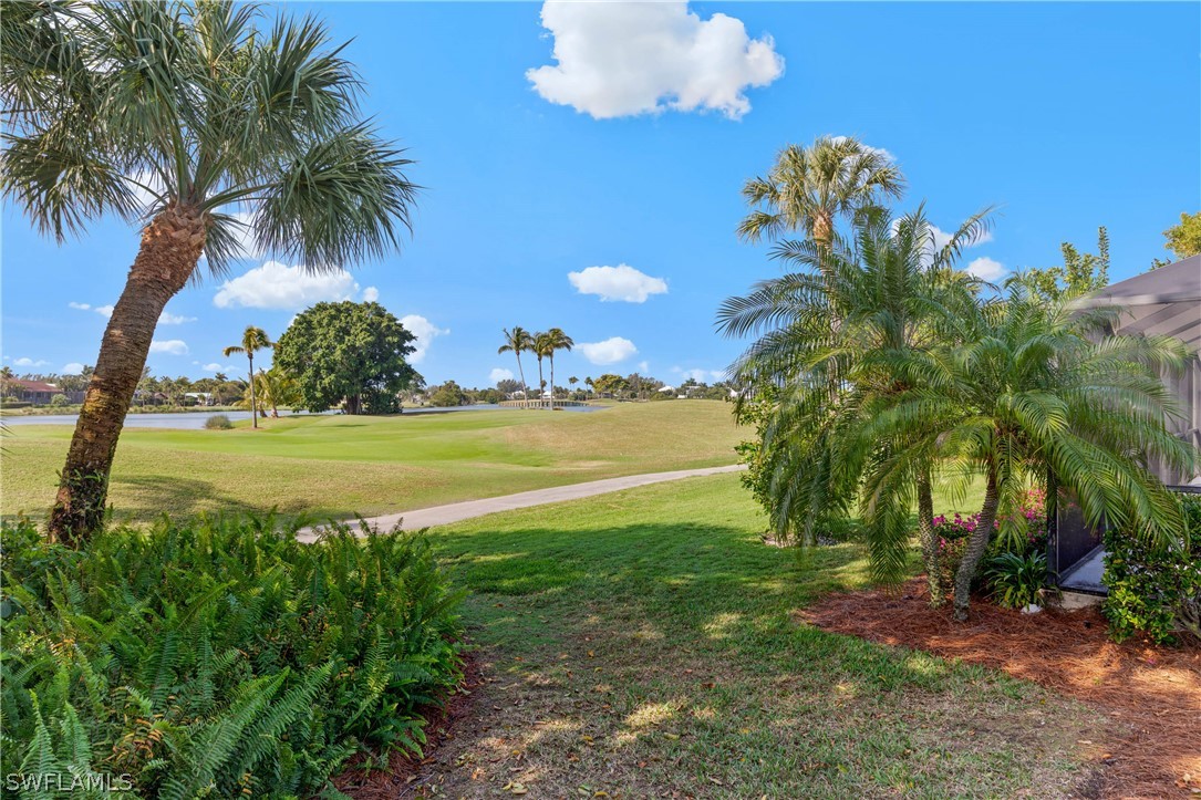975 Sand Castle Road Sanibel, FL 33957 - Photo 3 of 24 a view of a yard with a table and chairs