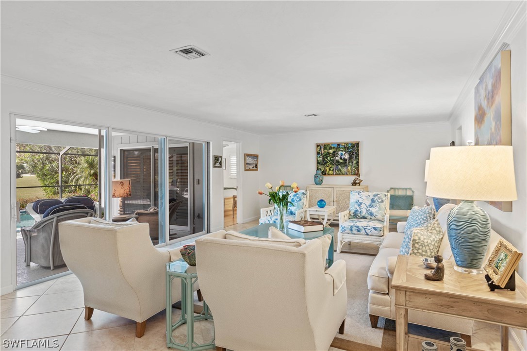 975 Sand Castle Road Sanibel, FL 33957 - Photo 6 of 24 a living room with furniture and a window