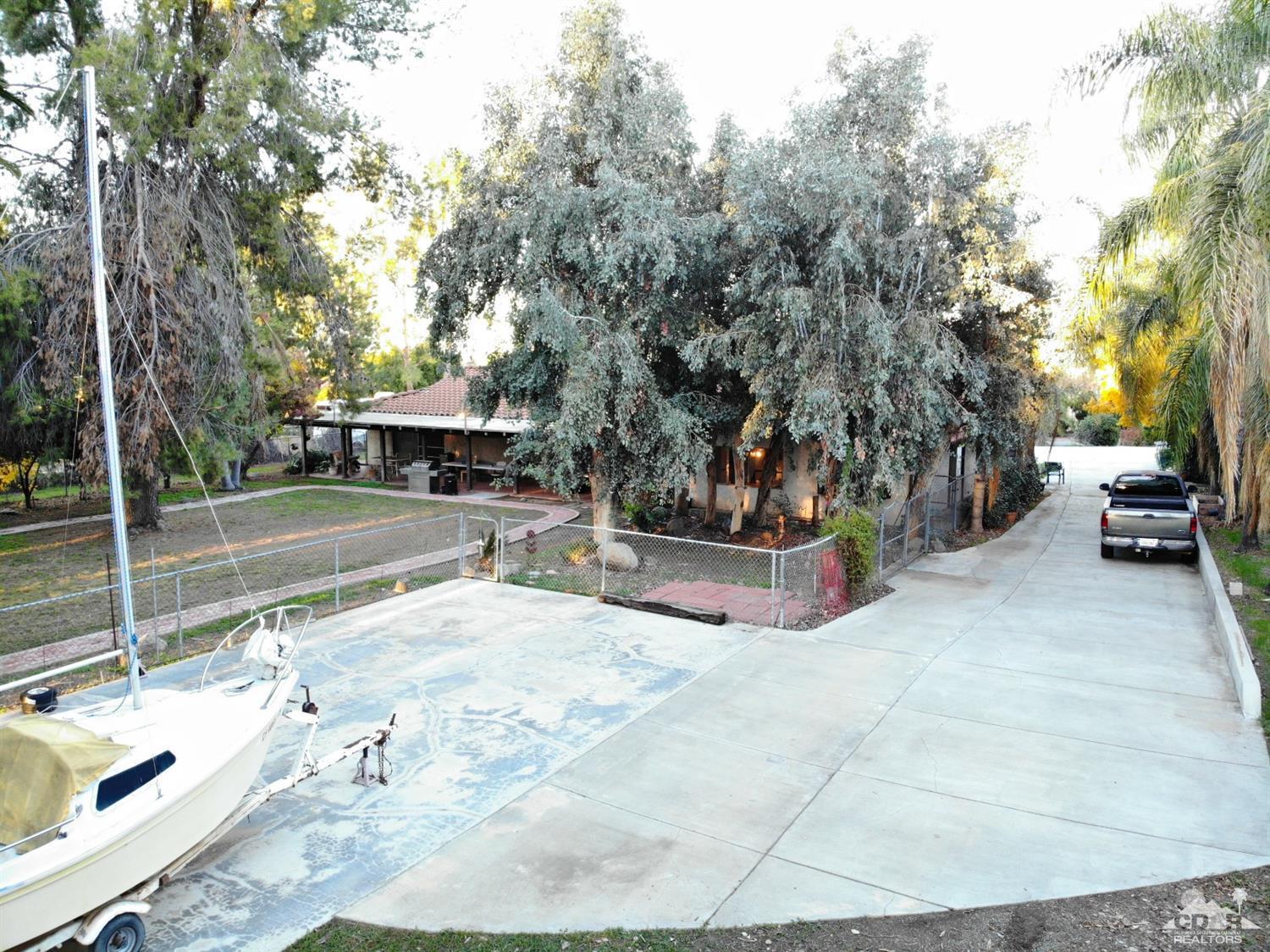 2132 John Street Riverside, CA 92503 - Photo 13 of 52 a view of a patio with a table and chairs and potted plants