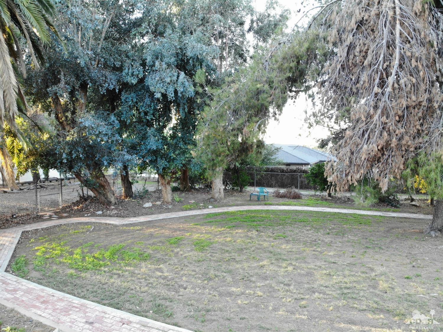 2132 John Street Riverside, CA 92503 - Photo 17 of 52 a backyard of a house with a yard and fountain