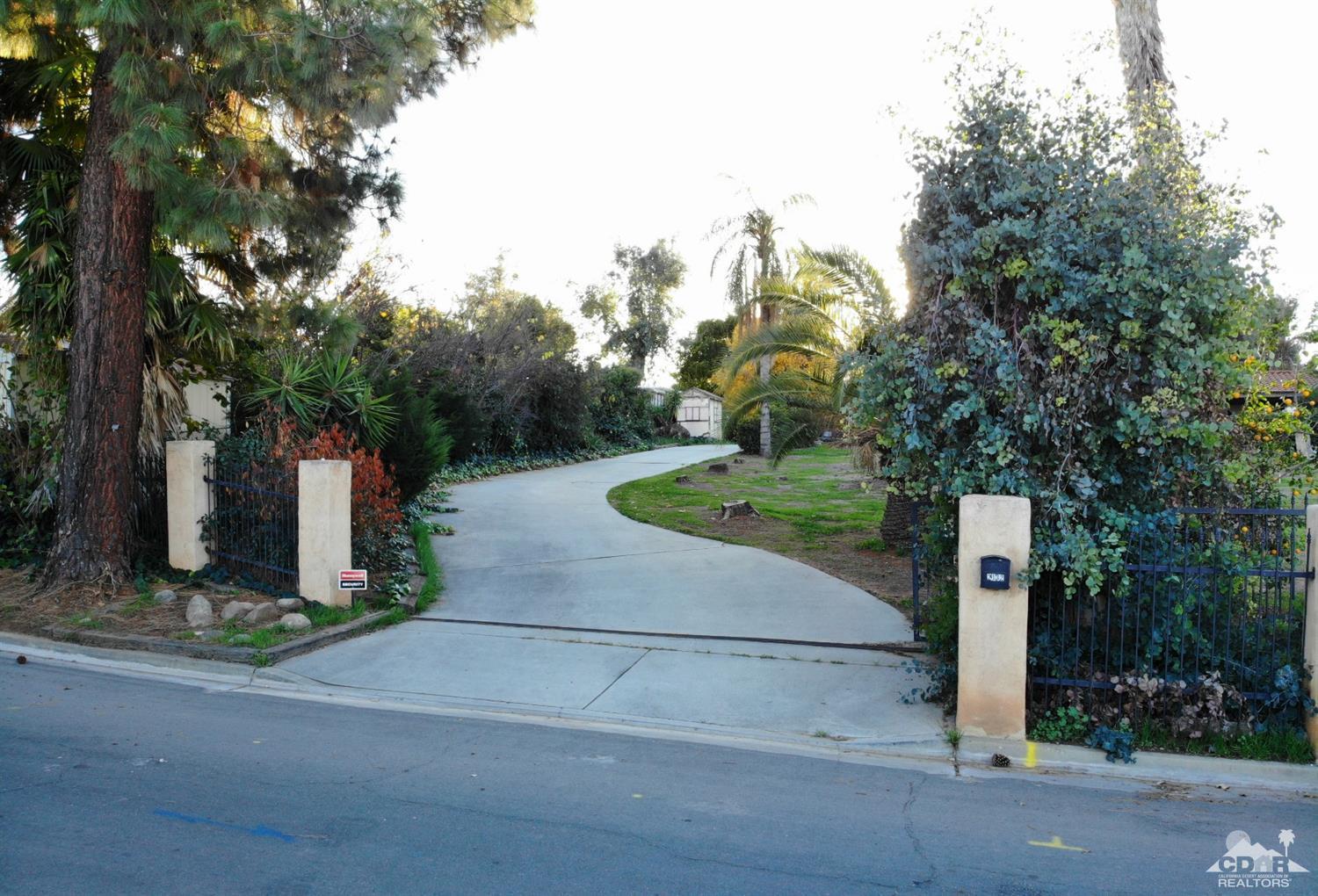 2132 John Street Riverside, CA 92503 - Photo 20 of 52 a street sign on a sidewalk next to a road