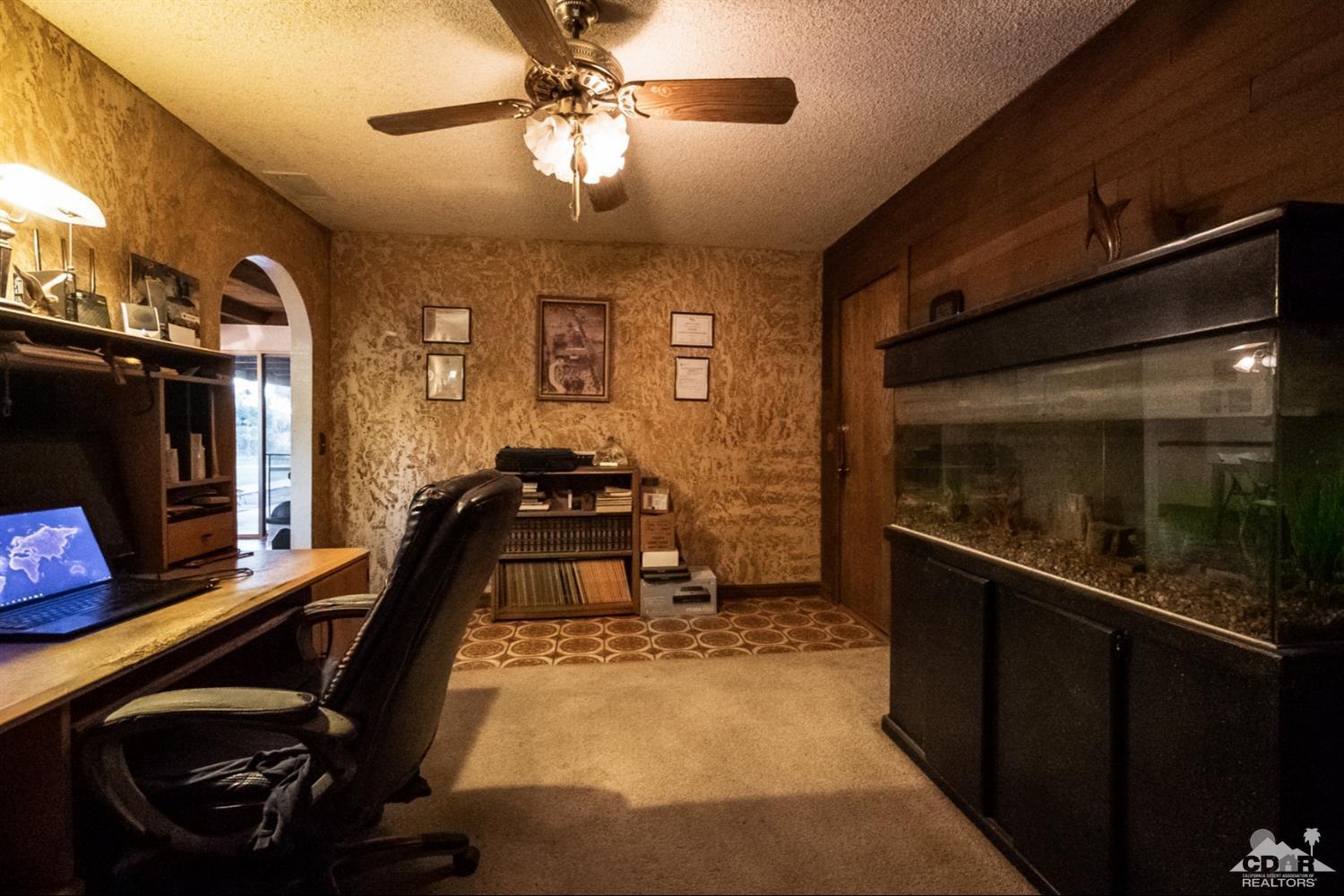 2132 John Street Riverside, CA 92503 - Photo 28 of 52 a room with gym equipment and a flat screen tv