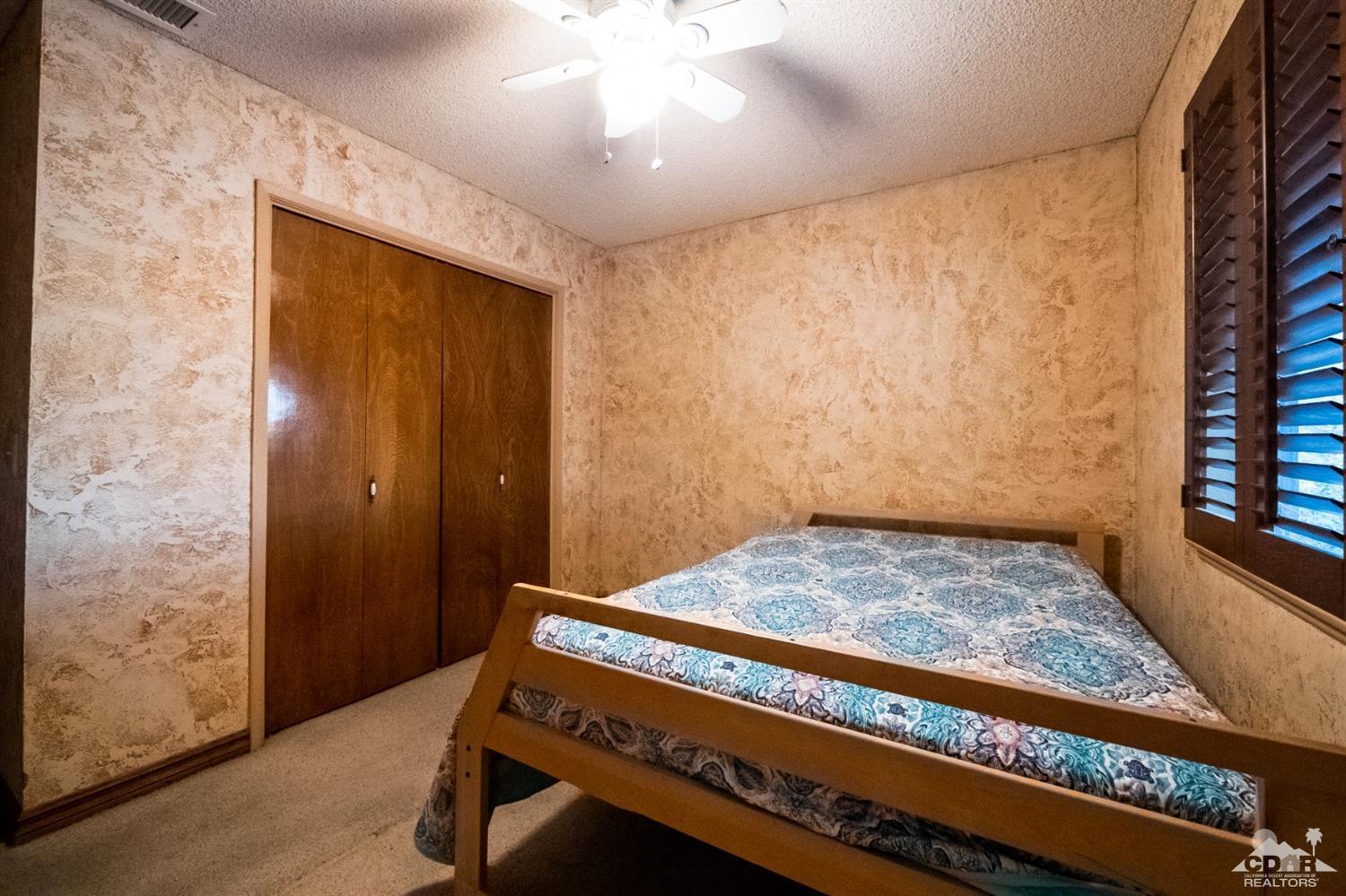 2132 John Street Riverside, CA 92503 - Photo 38 of 52 a bedroom with a bed and a window