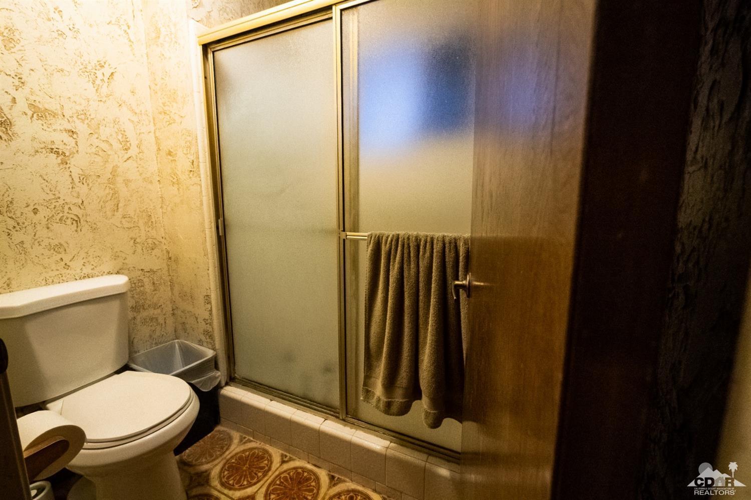 2132 John Street Riverside, CA 92503 - Photo 40 of 52 a bathroom with a toilet and a shower