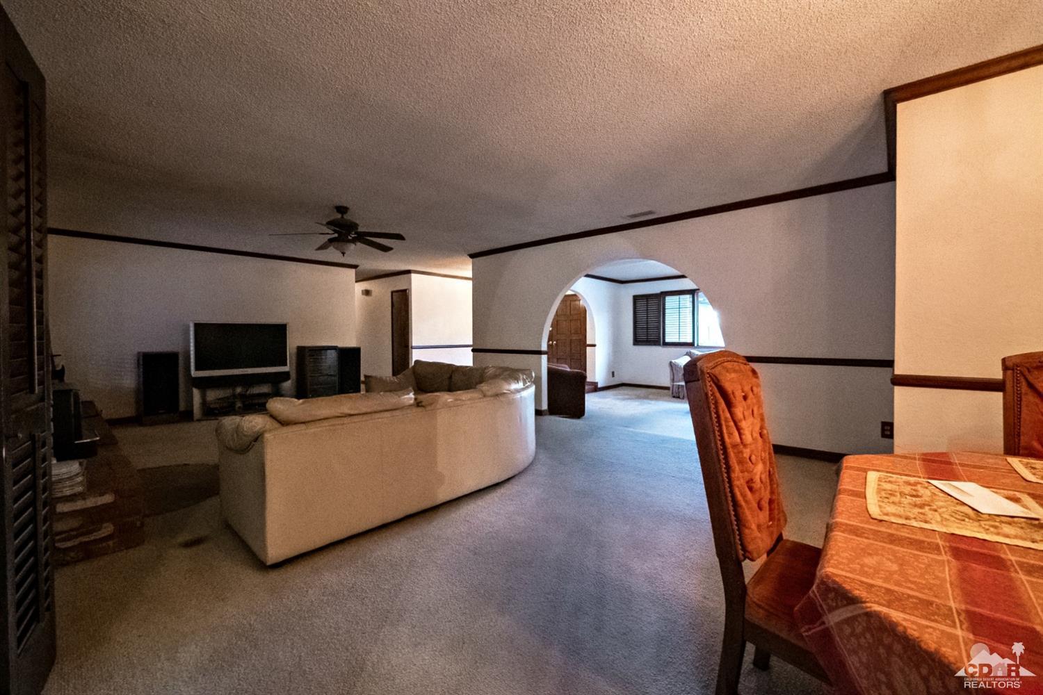 2132 John Street Riverside, CA 92503 - Photo 5 of 52 a living room with furniture and a flat screen tv