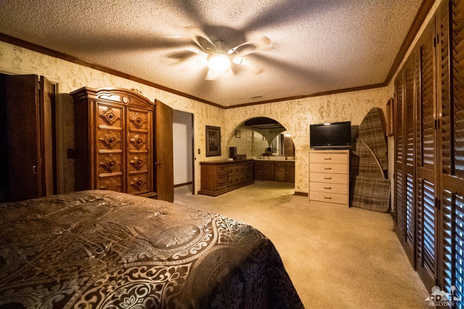 2132 John Street Riverside, CA 92503 - Photo 41 of 52 a bed room with a bed and a television