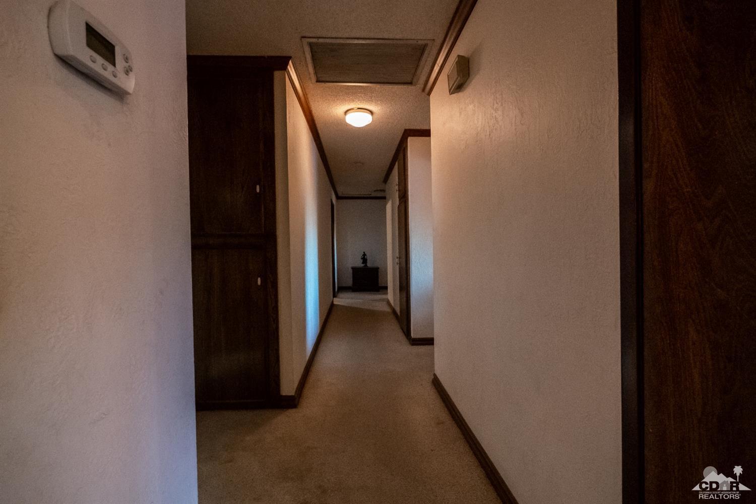 2132 John Street Riverside, CA 92503 - Photo 45 of 52 a view of a hallway with wooden floor
