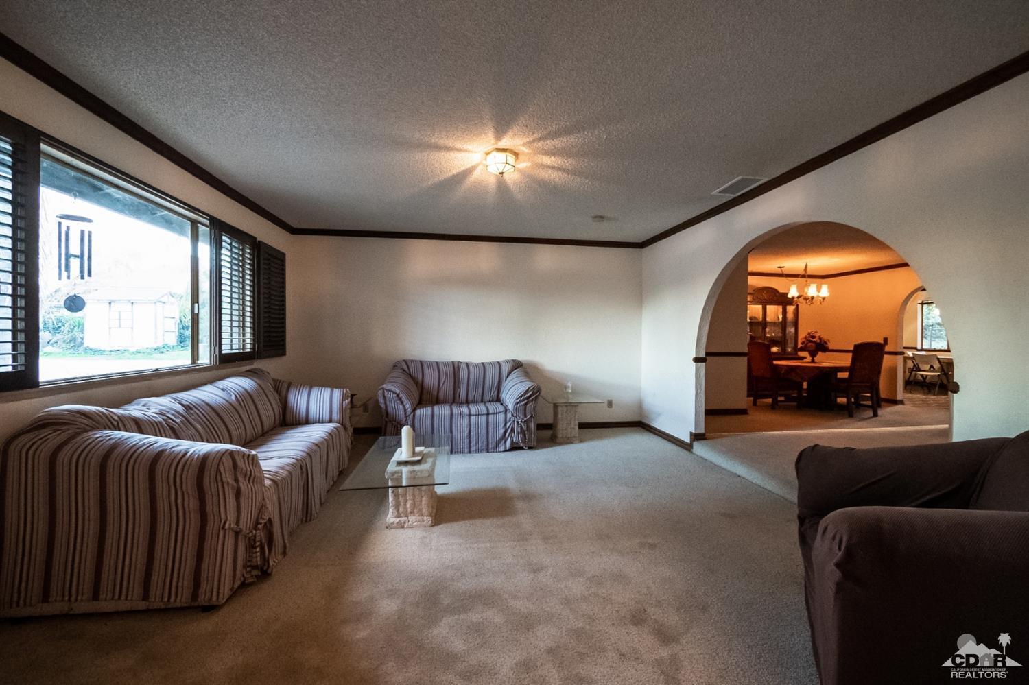 2132 John Street Riverside, CA 92503 - Photo 7 of 52 a living room with furniture and a large window
