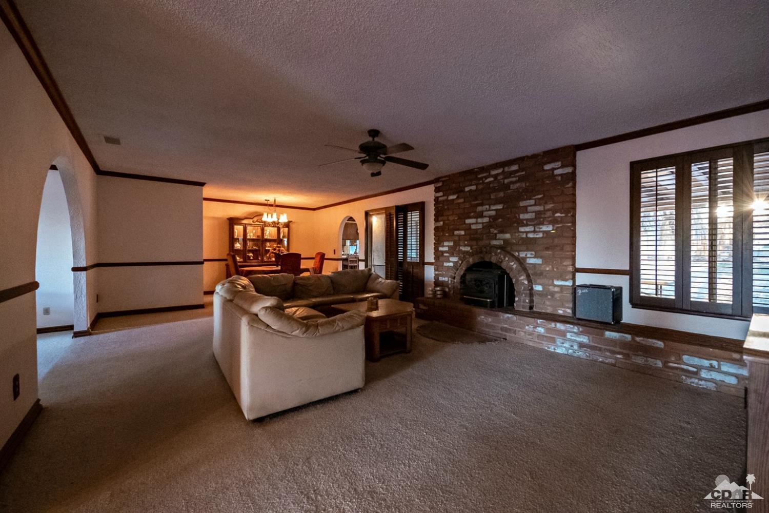 2132 John Street Riverside, CA 92503 - Photo 8 of 52 a living room with furniture and a fireplace