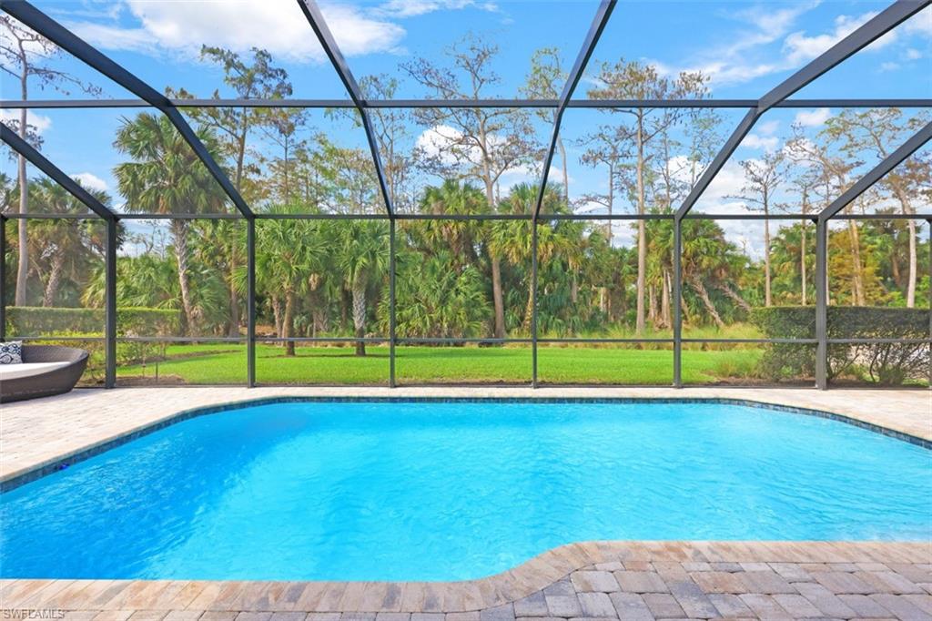 9431 Greyhawk Trail Naples, FL 34120 - Photo 1 of 50 a view of a indoor swimming pool