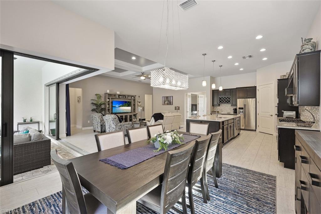 9431 Greyhawk Trail Naples, FL 34120 - Photo 16 of 50 a view of a dining room with furniture