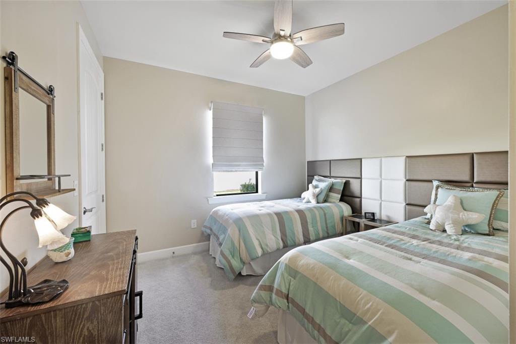 9431 Greyhawk Trail Naples, FL 34120 - Photo 23 of 50 a bedroom with two beds and painting on the wall