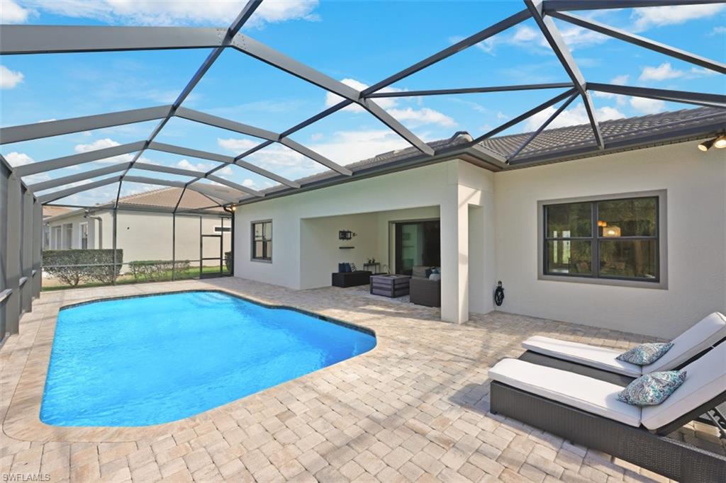 9431 Greyhawk Trail Naples, FL 34120 - Photo 31 of 50 a view of swimming pool with seating area