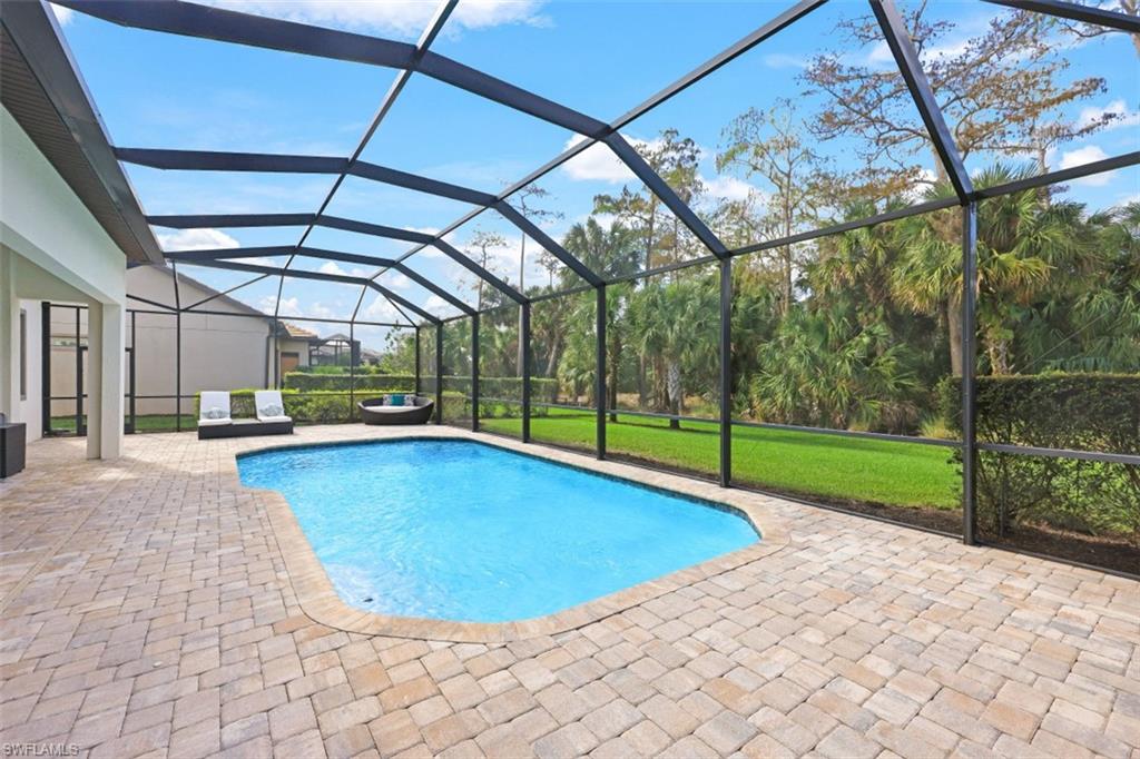 9431 Greyhawk Trail Naples, FL 34120 - Photo 32 of 50 a view of a backyard