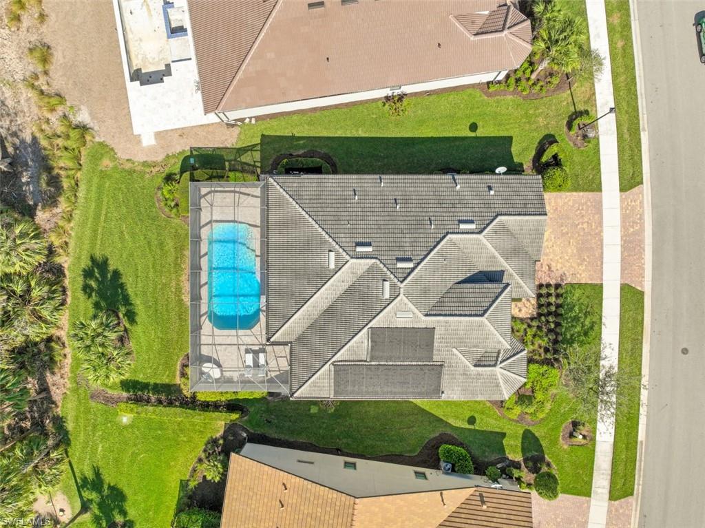 9431 Greyhawk Trail Naples, FL 34120 - Photo 36 of 50 an aerial view of a house with a yard