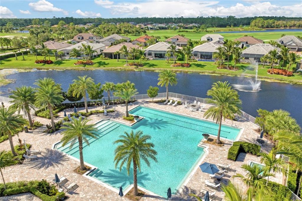 9431 Greyhawk Trail Naples, FL 34120 - Photo 40 of 50 a view of a city with lawn chairs