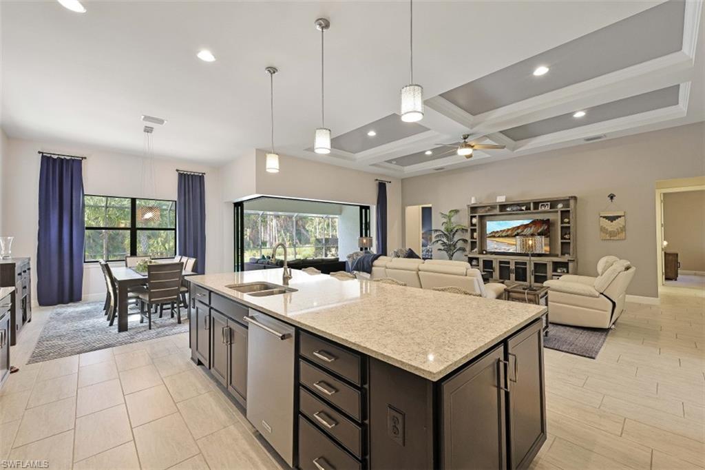 9431 Greyhawk Trail Naples, FL 34120 - Photo 4 of 50 a large kitchen with a table and chairs