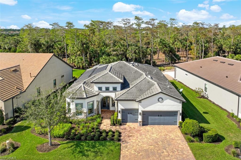 9431 Greyhawk Trail Naples, FL 34120 - Photo 43 of 50 an aerial view of a house with a yard basket ball court and outdoor seating