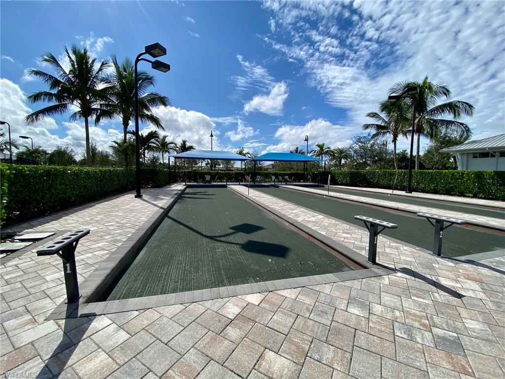 9431 Greyhawk Trail Naples, FL 34120 - Photo 44 of 50 a view of swimming pool with outdoor seating