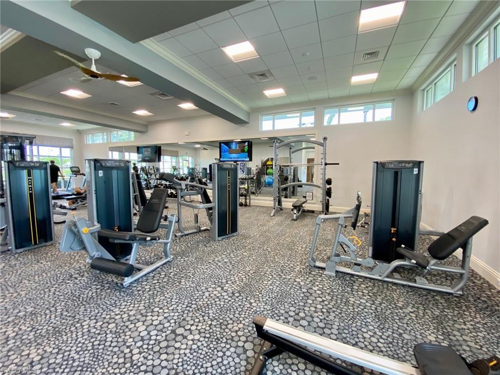 9431 Greyhawk Trail Naples, FL 34120 - Photo 46 of 50 a view of a room with gym equipment