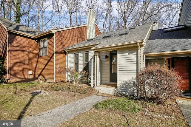 a picture of a bench in front of a wall