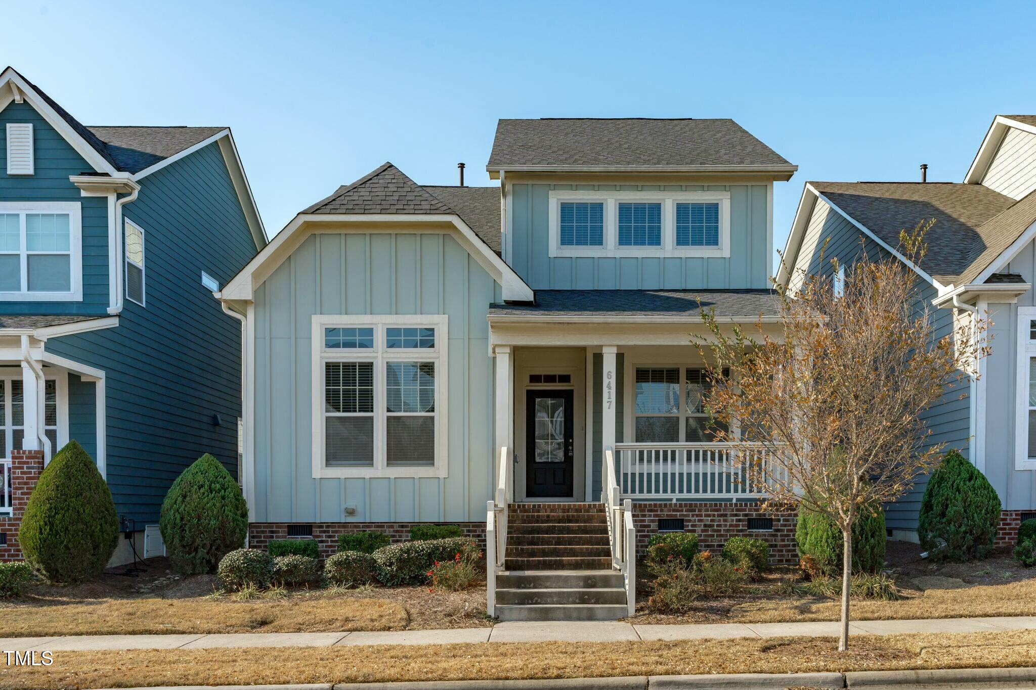 6417 Truxton Lane Raleigh, NC 27616 - Photo 1 of 47 a front view of a house with garden