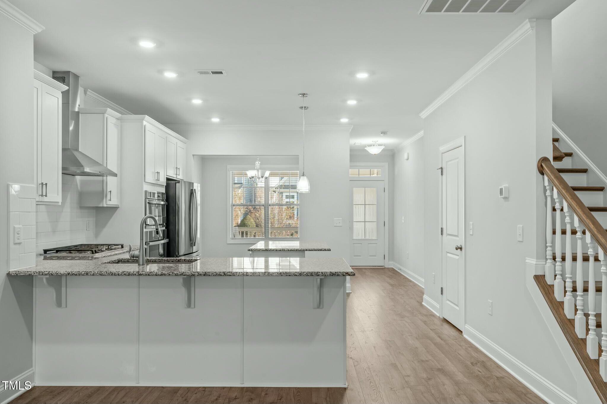 6417 Truxton Lane Raleigh, NC 27616 - Photo 13 of 47 a view of kitchen with stainless steel appliances granite countertop refrigerator stove and a sink